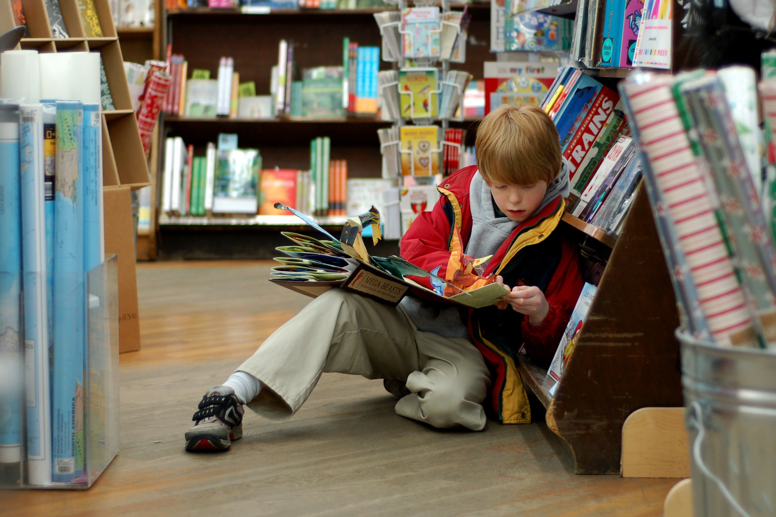 Child reading at a book store