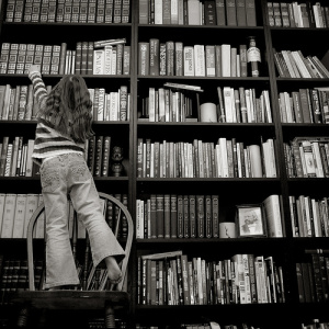 Child reaching on a chair