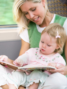 Mom and toddler sharing a book